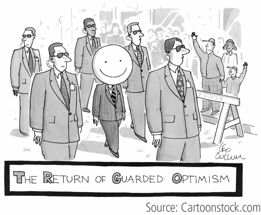 Cartoon showing a man with a smiley face and the headline "The Return of Guarded Optimism